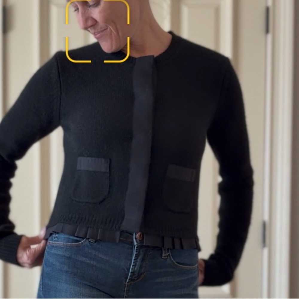 Zara Black Knit cashmere Sweater with ruffle and snap button detail.